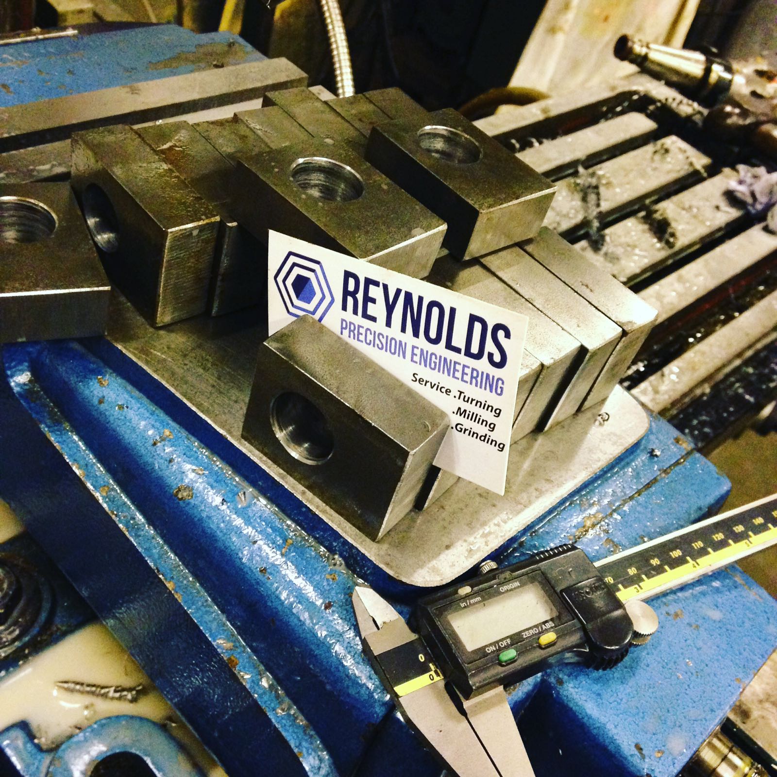 Our homepage image. Showing our contact information and the Reynolds Precision Engineering business card.
